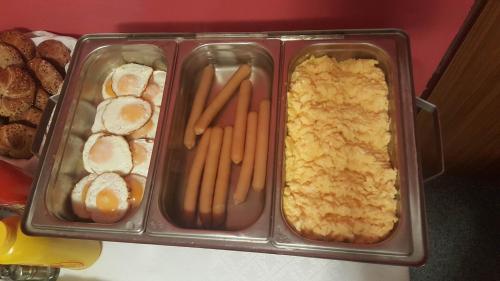 a tray of food with carrots and bread and pastries at Pension U Krbu in Mikulov v Krušných Horách