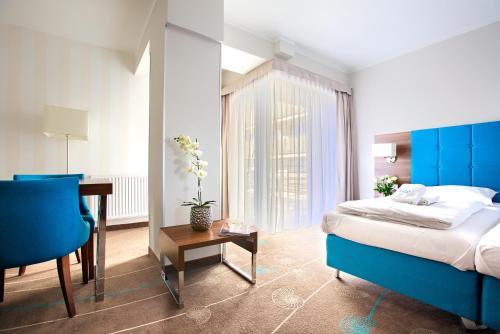 Katil atau katil-katil dalam bilik di Apartamenty AmberHome