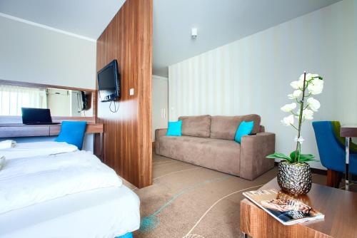 Katil atau katil-katil dalam bilik di Apartamenty AmberHome