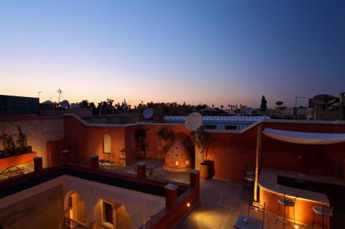 a view of the sunset from the roof of a building at Riad Dar Ten in Marrakech