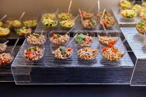 a bunch of appetizers on a buffet table at Argentina Residenza Style Hotel in Rome