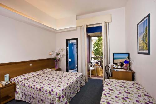 Postel nebo postele na pokoji v ubytování Hotel San Marco