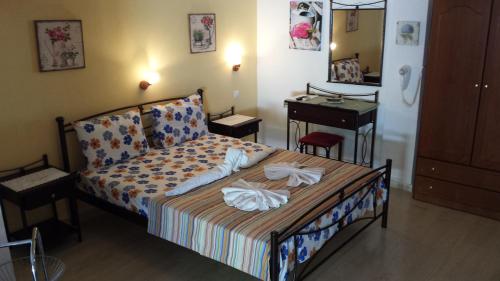 Postel nebo postele na pokoji v ubytování Eva Apartments