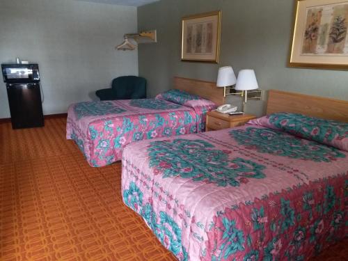 Katil atau katil-katil dalam bilik di Westgate Motel