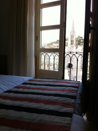 Postel nebo postele na pokoji v ubytování Hotel Vía Gótica