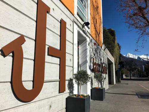a store sign on the side of a building at Jazz Hotel Ascona in Ascona