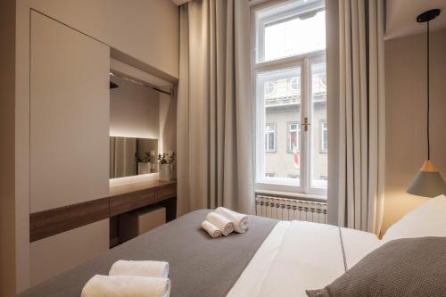 Zagreb Sleep & Eat tesisinde bir odada yatak veya yataklar
