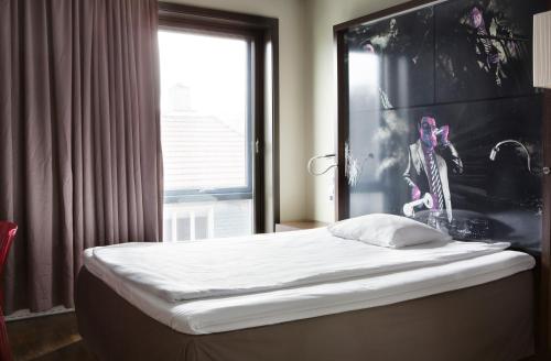 Ένα ή περισσότερα κρεβάτια σε δωμάτιο στο Comfort Hotel Square