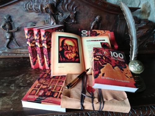 a pile of books sitting on top of a table at Caseria la Infiesta in Caleao