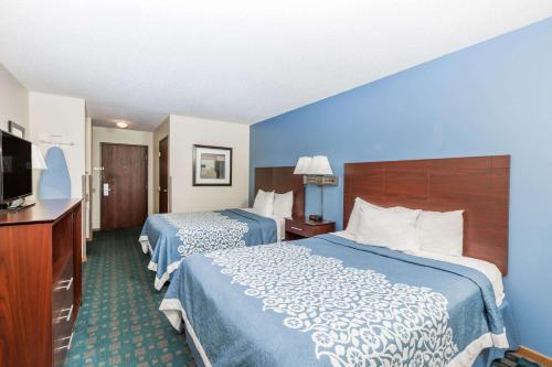 Ένα ή περισσότερα κρεβάτια σε δωμάτιο στο Days Inn by Wyndham Sioux City