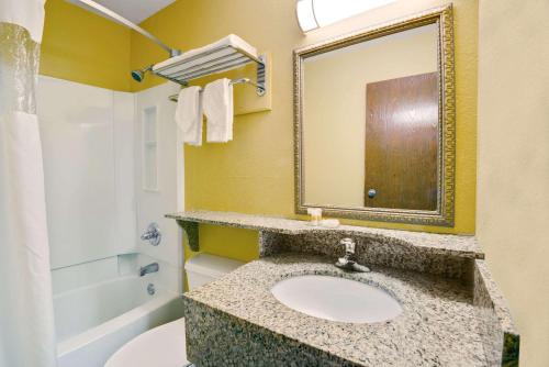 A bathroom at Days Inn by Wyndham Torrington