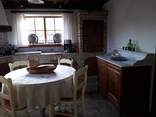 a kitchen with a table with a bowl on it at De Perelaar in Jabbeke