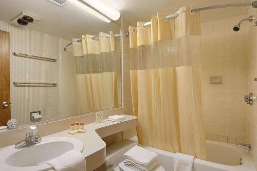 a bathroom with a sink and a shower at Days Inn by Wyndham Colorado Springs/Garden of the Gods in Colorado Springs