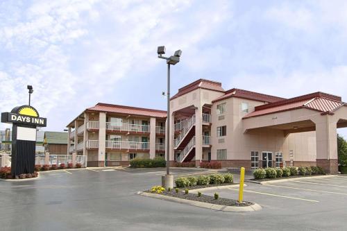 an empty parking lot in front of a hotel at Days Inn by Wyndham Airport Nashville East in Nashville