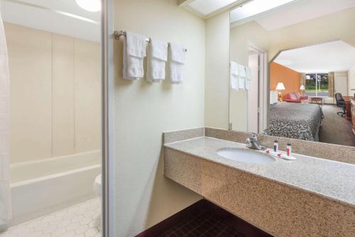 A bathroom at Days Inn by Wyndham Orangeburg South