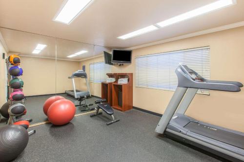 an office with a gym with a treadmill and exercise equipment at Days Inn by Wyndham Camarillo - Ventura in Camarillo