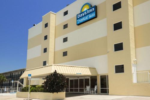 a hotel with a sign on the side of it at Days Inn by Wyndham Daytona Oceanfront in Daytona Beach