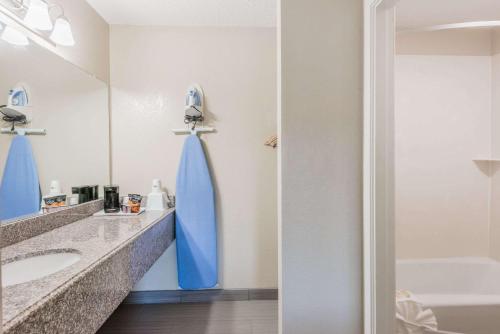 a bathroom with a sink and a mirror at Days Inn by Wyndham San Marcos in San Marcos