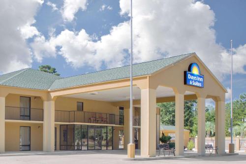 a building with a sign that reads durham hospital at Days Inn by Wyndham Andalusia in Andalusia