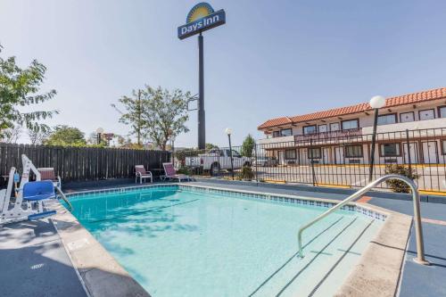 a swimming pool at a hotel with a hotel at Days Inn by Wyndham Castaic Six Flags Magic Mountain in Castaic