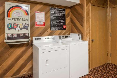 a white washer and dryer in a room at Days Inn by Wyndham Mexico in Mexico