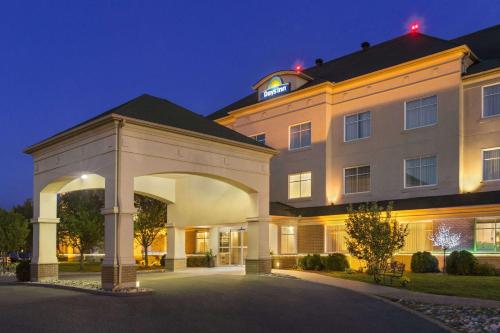 a rendering of a hotel at night at Days Inn by Wyndham Ottawa Airport in Ottawa