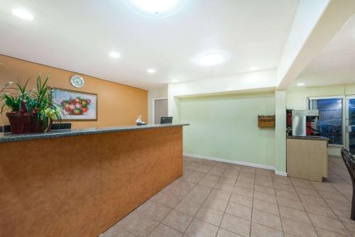 a lobby of a hospital with a reception counter at Days Inn by Wyndham Socorro in Socorro
