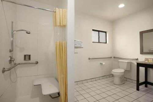 a bathroom with a shower and a toilet at Americas Best Value Inn Blythe CA in Blythe