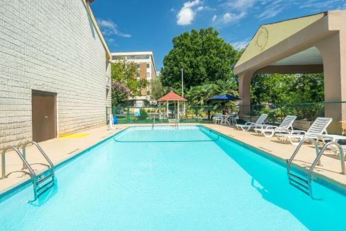 The swimming pool at or close to Days Inn by Wyndham Raleigh Midtown