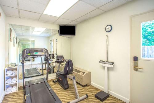 a hospital room with a gym with a treadmill at Days Inn by Wyndham Salem in Salem