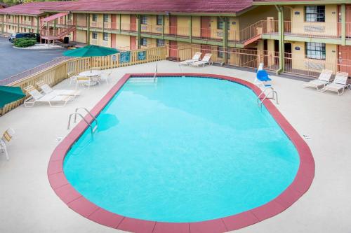 an overhead view of a swimming pool at a hotel at Days Inn by Wyndham Little Rock/Medical Center in Little Rock