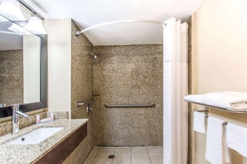 a bathroom with a shower and a sink at Days Inn by Wyndham Fort Lauderdale Airport Cruise Port in Fort Lauderdale