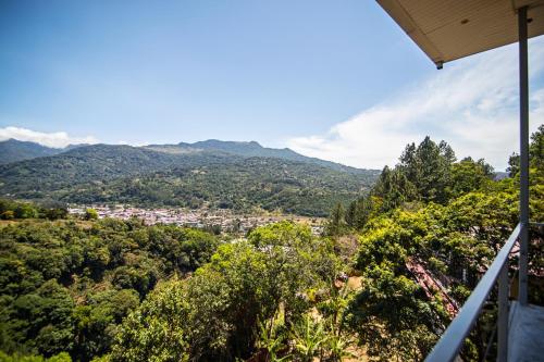 a view of a city from the balcony of a house at Casa Ejecutiva Boquete in Boquete