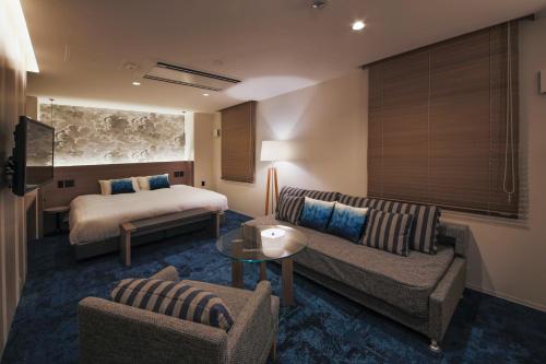 Säng eller sängar i ett rum på Hotel Code Shinsaibashi