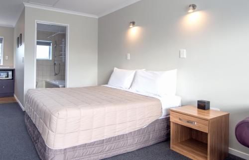 Voodi või voodid majutusasutuse Tower Lodge Motel toas
