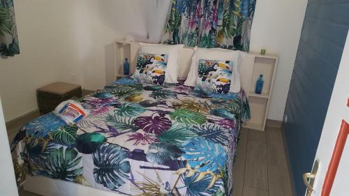 Кровать или кровати в номере Cocon des Alizés