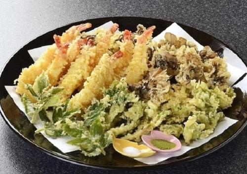 a plate of food on a table with a salad at Hotel New Momiji in Nasushiobara