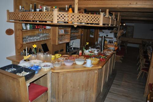 a kitchen with a counter with food on it at Alpengasthof Eppensteiner in Navis