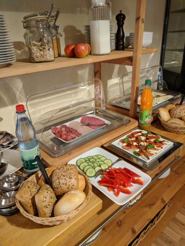 a kitchen counter with various food items on it at Haus am Grasberg in Poppenhausen