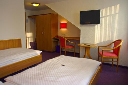 Un ou plusieurs lits dans un hébergement de l'établissement Hotel Park Eckersbach
