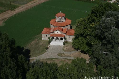 an aerial view of a house with a red roof at Yannis Hotel in Krinídhes