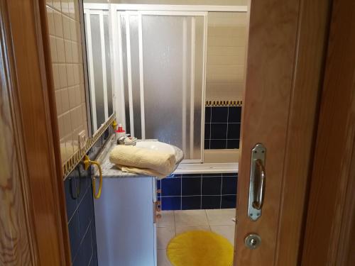 a bathroom with a sink and a shower at THE POPPIES Guest House - 100m Ocean - Private Spaces in Candelaria