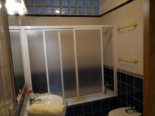 a bathroom with a shower and a sink at THE POPPIES Guest House - 100m Ocean - Private Spaces in Candelaria