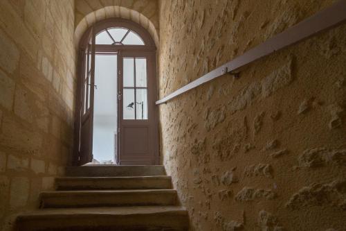 a stairway with a door and a window at Bordeaux Village Blaye in Blaye
