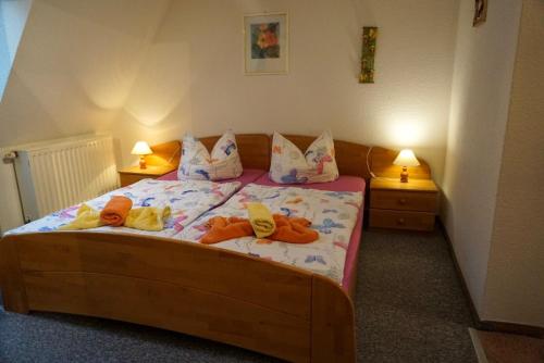 a bedroom with a bed with stuffed animals on it at Ferienwohnung Albrecht Sonnendeck in Bad Schandau