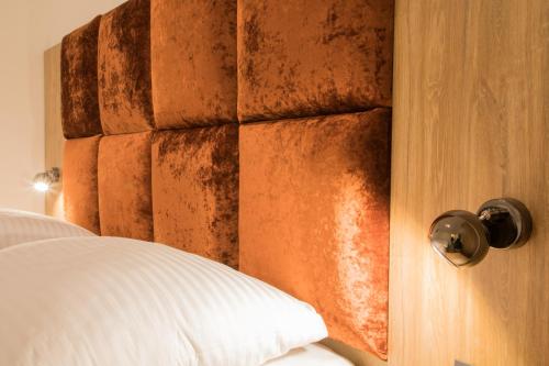 a close up of a bedroom door with a bed at Travego Osijek in Osijek