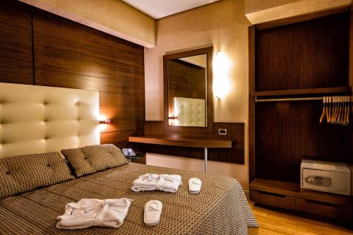 En eller flere senge i et værelse på Nafs Hotel