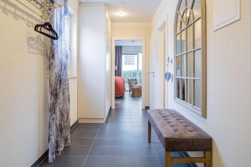 a corridor with a bench in a hallway at HOMEBOUND APARTMENTS Salzburg City II - contactless check-in in Salzburg