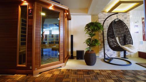 a room with a mirror and a potted plant at Penzión Talisman in Rajecké Teplice