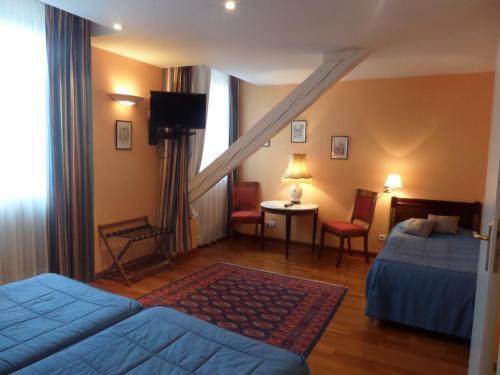 Postel nebo postele na pokoji v ubytování Hôtel Restaurant Erckmann Chatrian